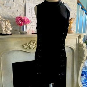 Sexy little black dress with side criss cross silver grommet detailing.